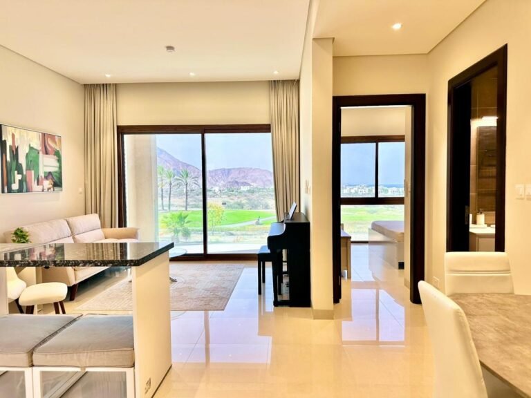 Modern 1-bedroom apartment with a stunning golf view for sale in Jebel Sifah