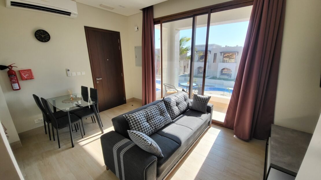 Furnished open living and dining area in studio RV26-101, Riviera, Hawana Salalah