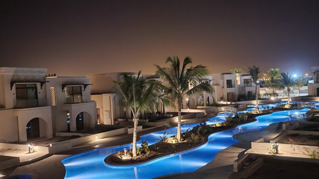 Evening view of the communal pool at Riviera, Hawana Salalah, from the supplied RV26-101 property photos